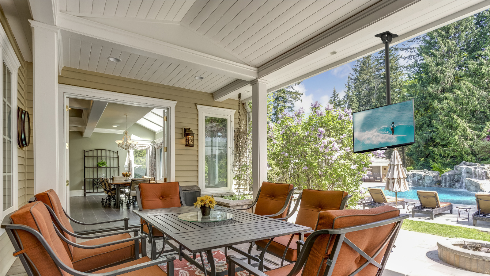 A covered deck with a TV on a Kanto Mount