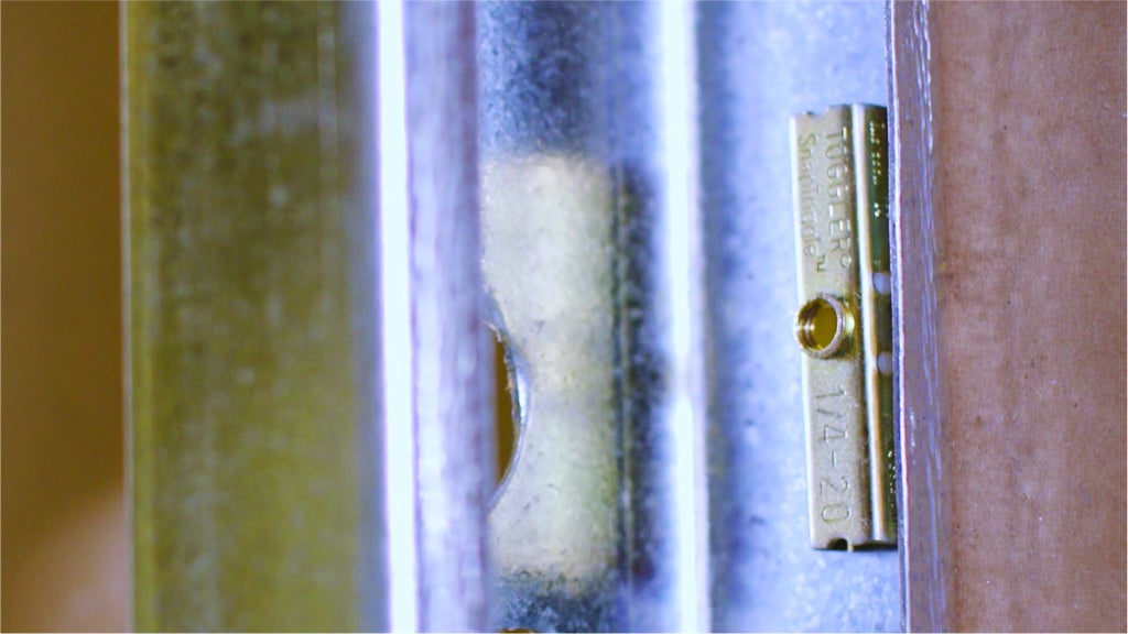 Securing a bolt into metal studs